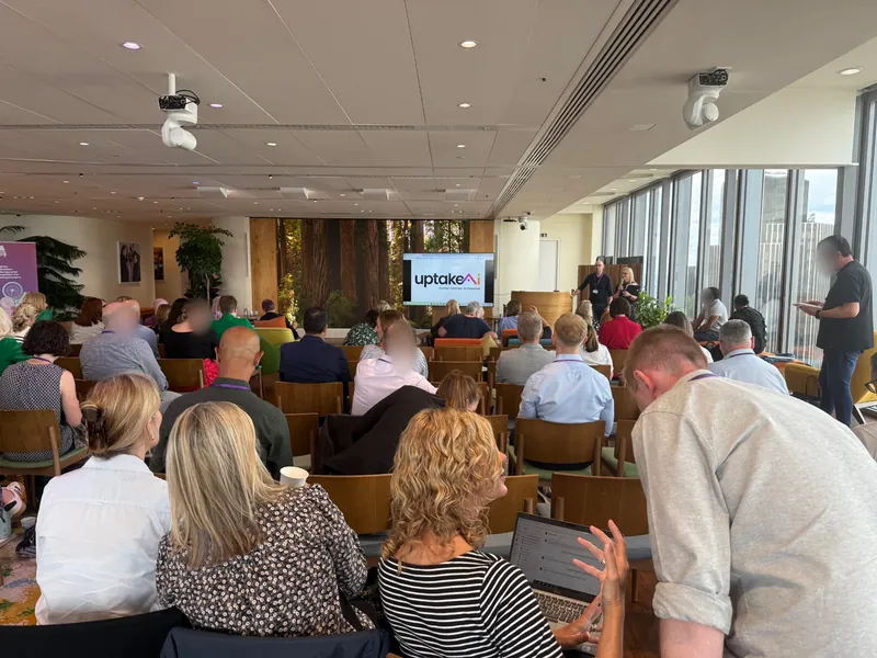 Delegates working together during an uptakeAI workshop